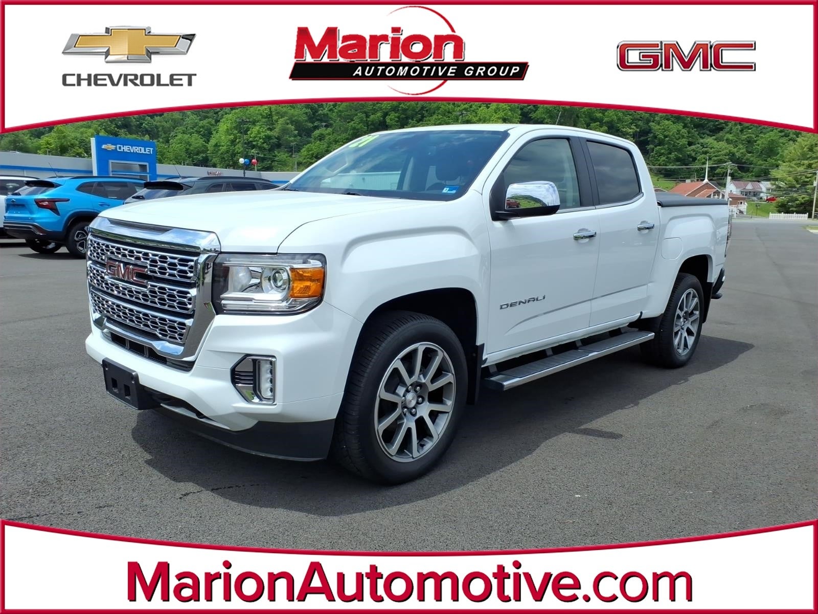 2021 GMC Canyon 4WD Denali in Summit White — front three-quarter view